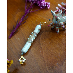 cream and dried blood ear flail - buckle